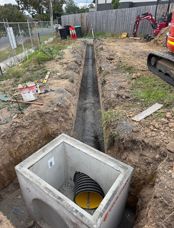 Underground drainage excavation at residential property
