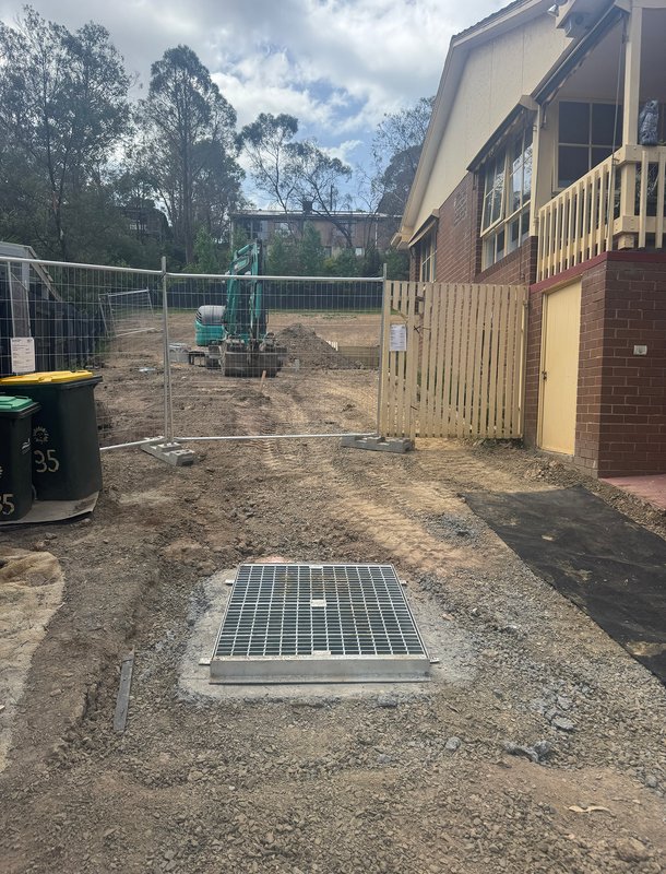 Newly installed stormwater pit with grate cover
