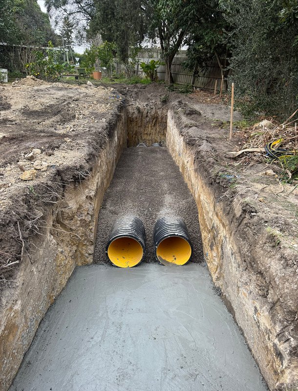 Dual sewer or stormwater pipes laid in trench